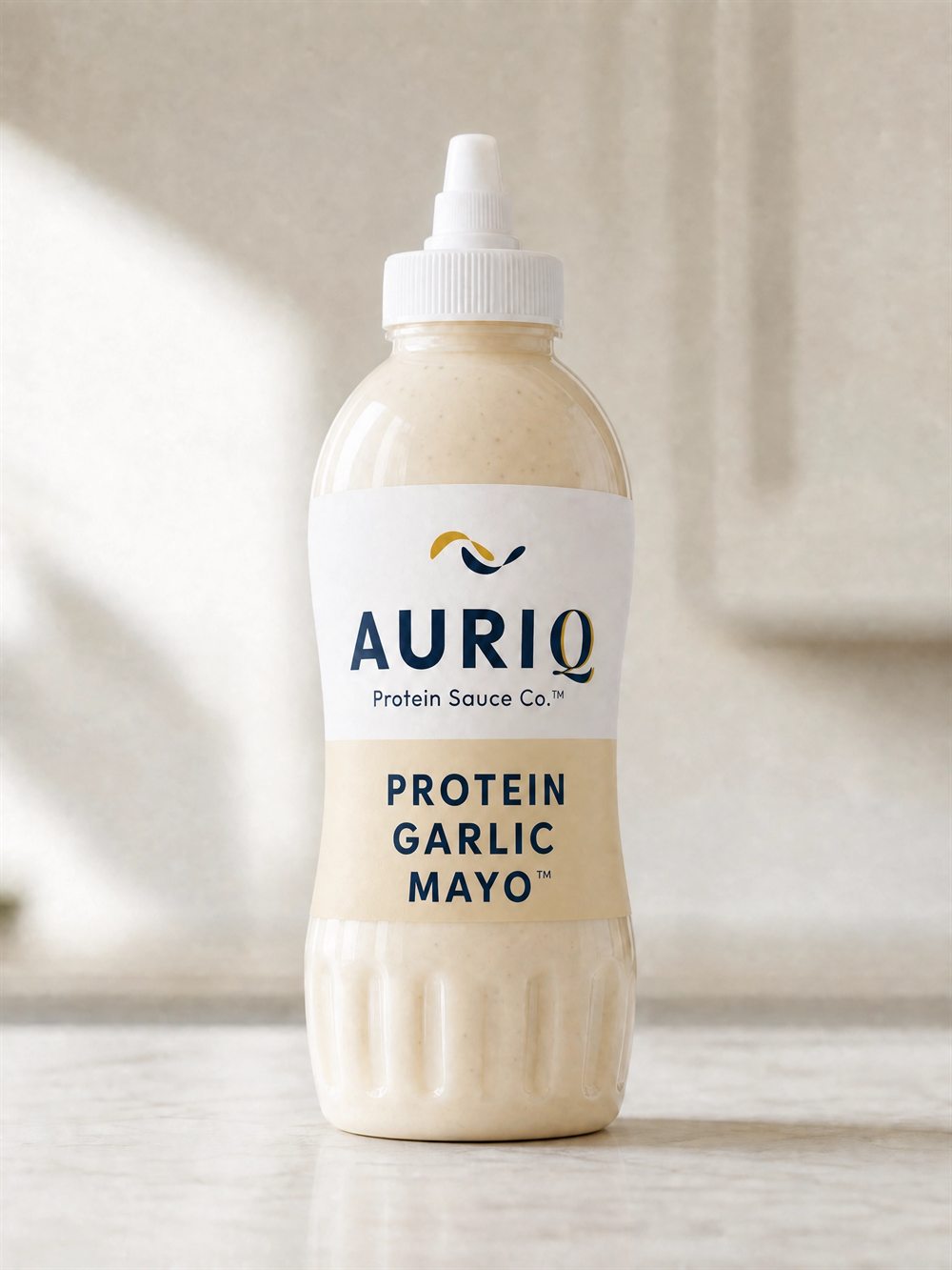 AURIQ Protein Garlic Mayo squeeze bottle on a kitchen counter