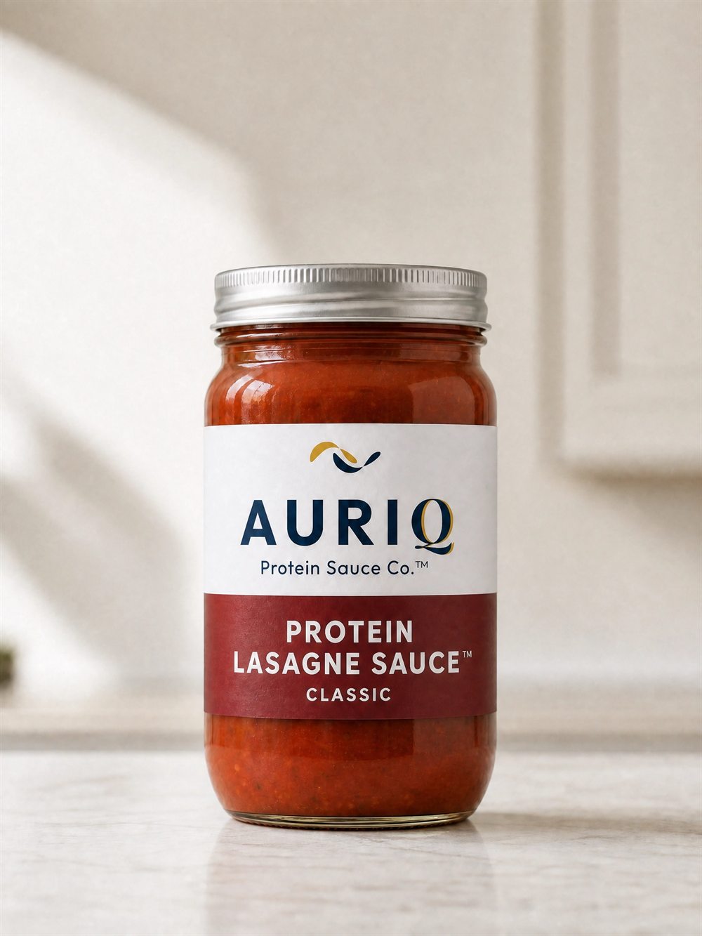 AURIQ Protein Lasagne Sauce glass jar on a kitchen counter