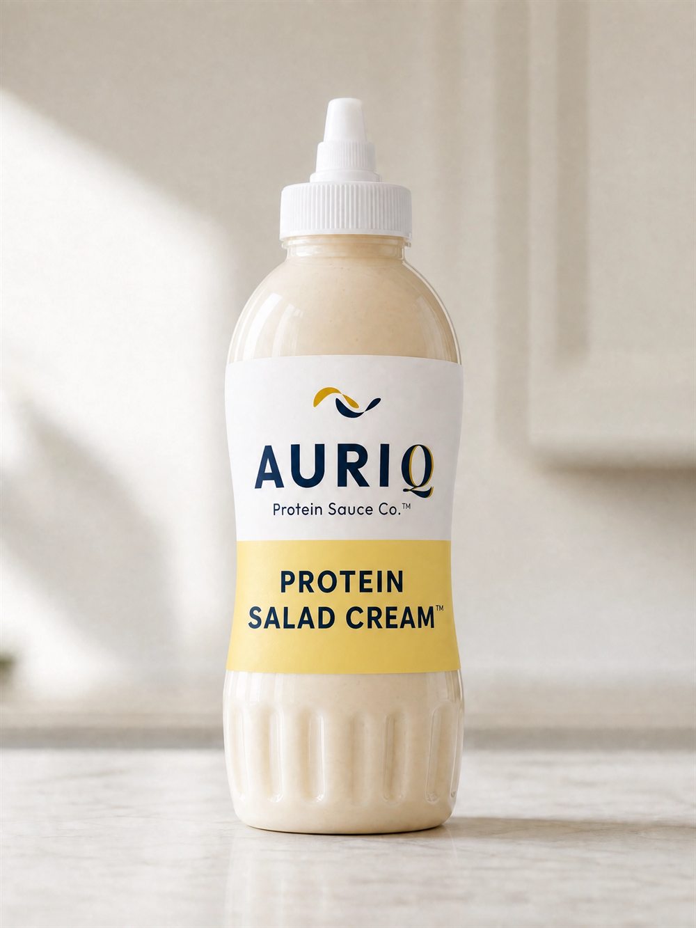 AURIQ Protein Salad Cream squeeze bottle on a kitchen counter